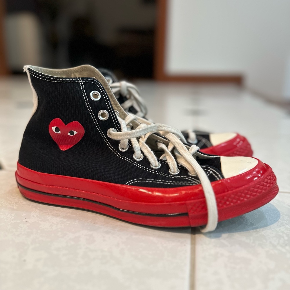 Comme Des Garcons PLAY
x Converse Unisex Chuck Taylor High Top Sneakers